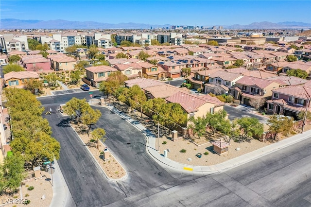 aerial view featuring a mountain view and a residential view