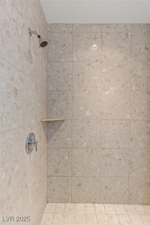 bathroom with tiled shower