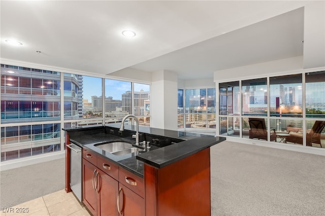 kitchen with a view of city, a sink, stainless steel dishwasher, open floor plan, and light colored carpet