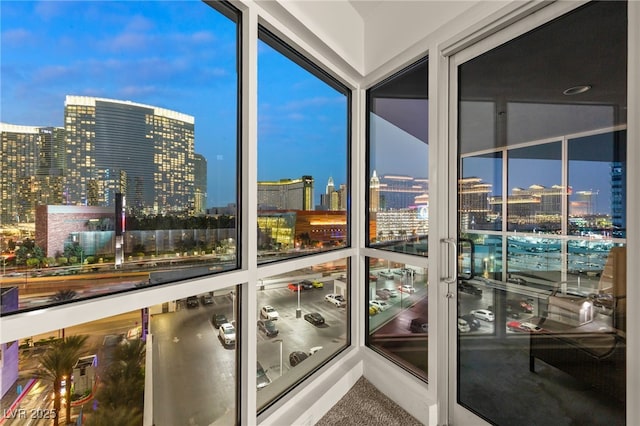 sunroom / solarium featuring a view of city