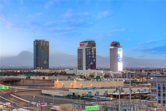 property's view of city featuring a mountain view