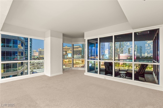 unfurnished sunroom featuring a view of city