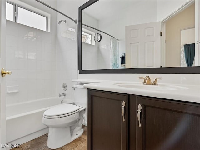 bathroom with tile patterned floors, shower / bath combination with curtain, toilet, and vanity