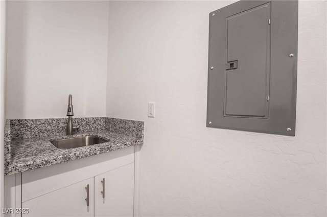 bathroom featuring vanity and electric panel