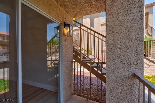 view of gate featuring stairs