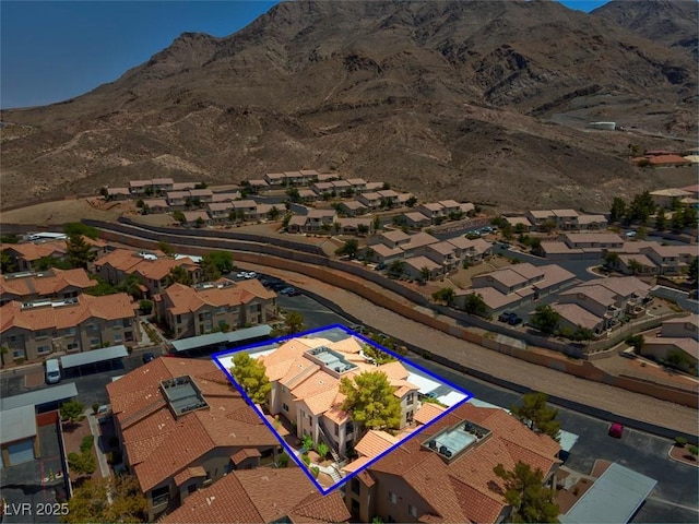 aerial view with a mountain view and a residential view