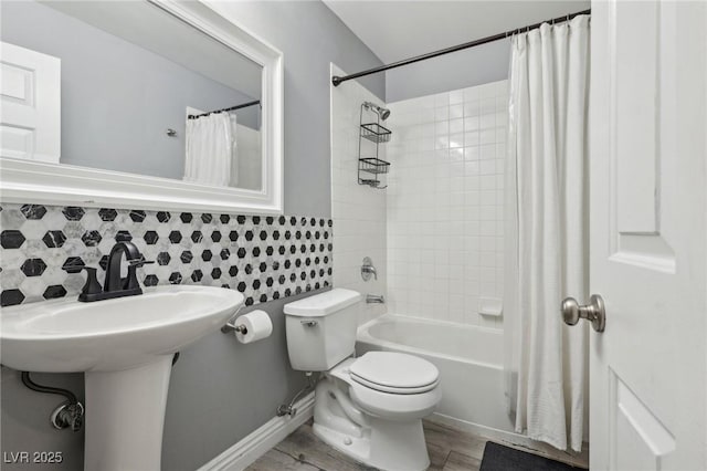 full bathroom with toilet and shower / tub combo with curtain