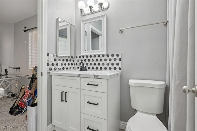 bathroom featuring toilet and vanity