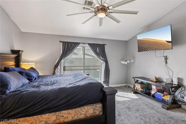 carpeted bedroom with baseboards, ceiling fan, and vaulted ceiling