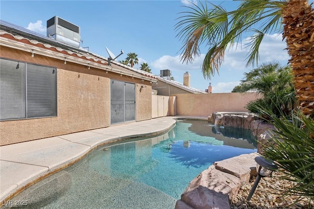 view of pool with cooling unit, a fenced backyard, and a fenced in pool