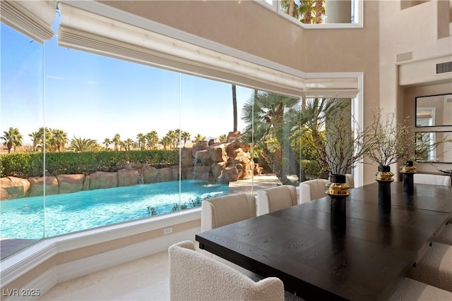 view of swimming pool with a fenced in pool and outdoor dining space