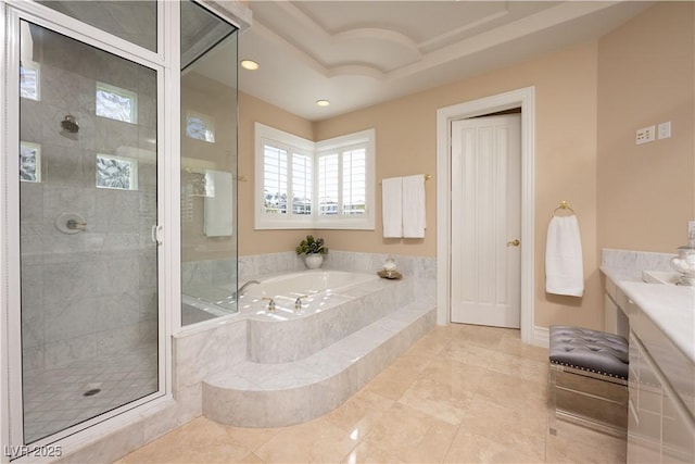 full bath featuring recessed lighting, a stall shower, vanity, and a garden tub