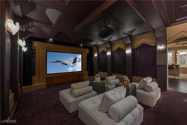 carpeted cinema room featuring beamed ceiling and coffered ceiling