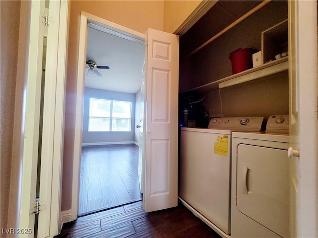 laundry room with baseboards, washing machine and clothes dryer, laundry area, ceiling fan, and dark wood-type flooring