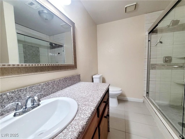 full bathroom featuring vanity, visible vents, a stall shower, tile patterned flooring, and toilet