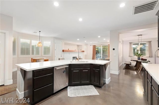 kitchen featuring visible vents, a sink, light countertops, stainless steel dishwasher, and tasteful backsplash