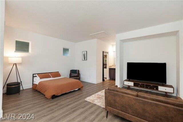 bedroom featuring light wood-style flooring and baseboards