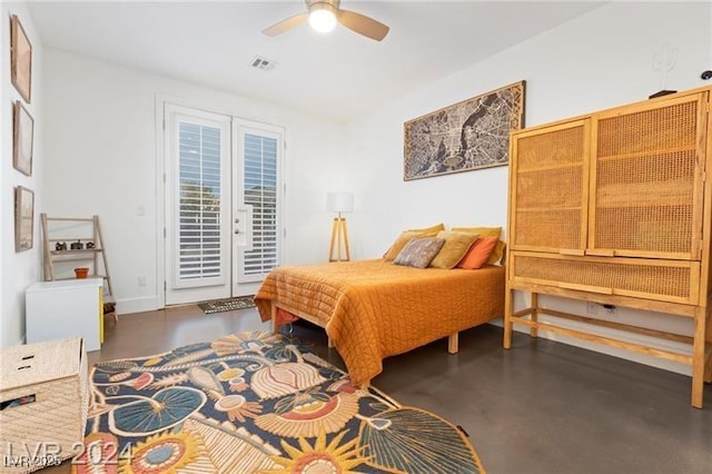 bedroom featuring access to exterior, visible vents, concrete floors, and a ceiling fan