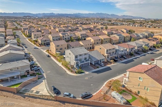 drone / aerial view featuring a mountain view and a residential view