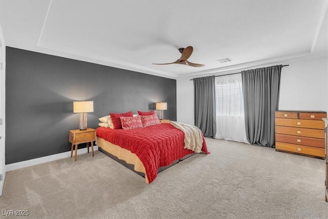 carpeted bedroom with visible vents, baseboards, and ceiling fan