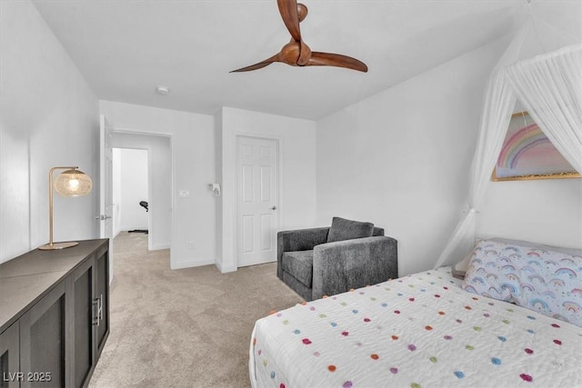 bedroom featuring light colored carpet, baseboards, and ceiling fan