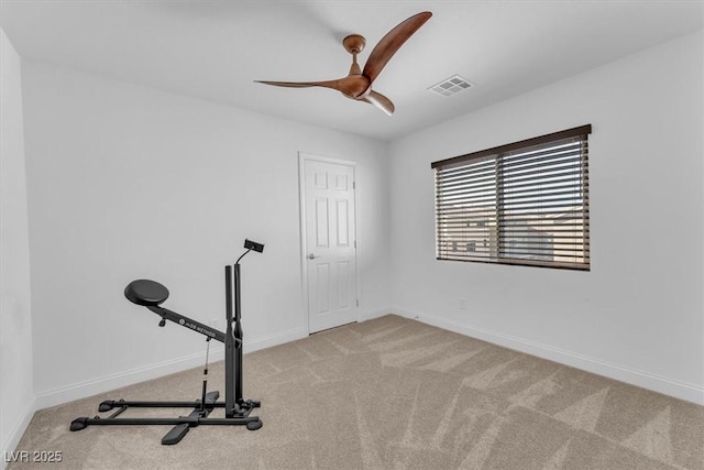 exercise area with visible vents, ceiling fan, baseboards, and carpet floors