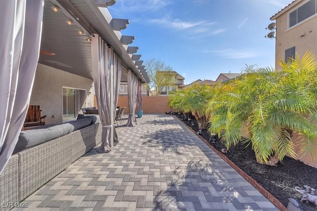 view of patio featuring fence