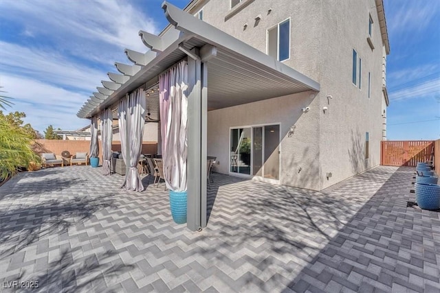 exterior space with a patio, fence private yard, and stucco siding