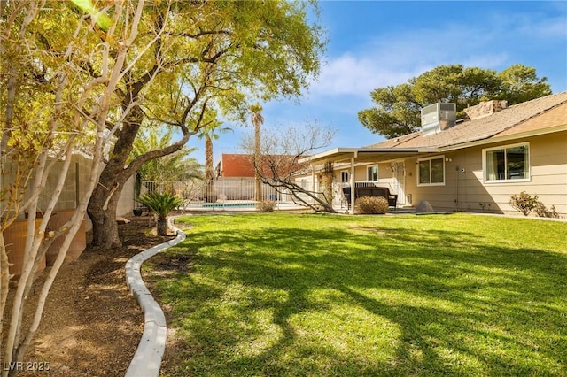 view of yard featuring central AC unit, a fenced backyard, and a fenced in pool