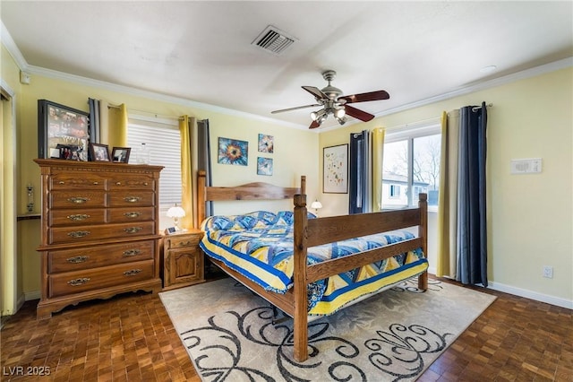 bedroom featuring visible vents, baseboards, a ceiling fan, and crown molding