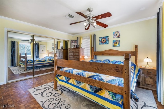 bedroom with visible vents, ceiling fan, ornamental molding, brick floor, and a closet