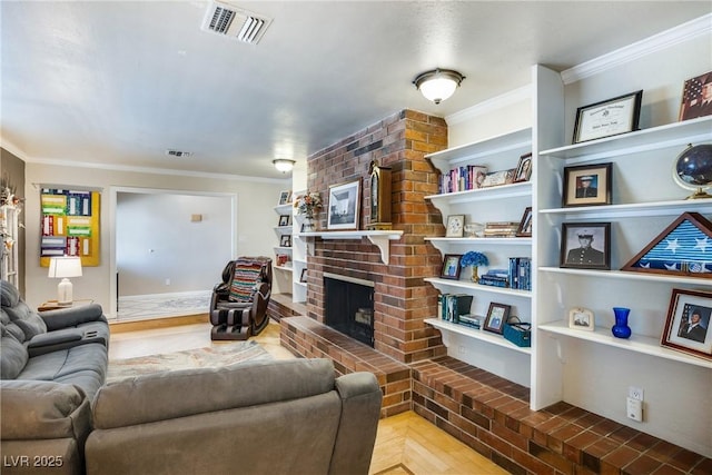 living room featuring visible vents, a fireplace, and crown molding