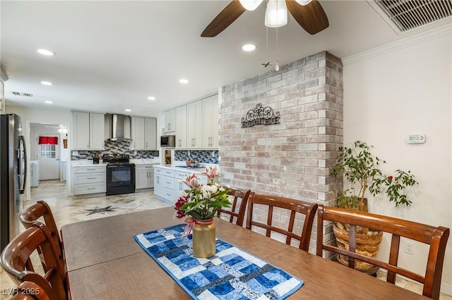 dining area with visible vents and a ceiling fan