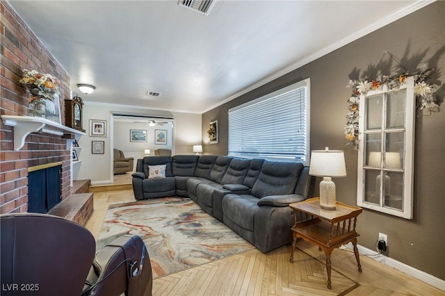 living room featuring visible vents, a fireplace, baseboards, and ornamental molding