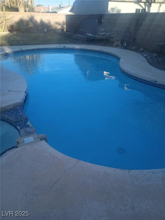 view of swimming pool featuring a fenced in pool and a fenced backyard