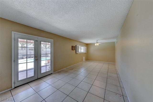 unfurnished room with french doors, ceiling fan, and light tile patterned flooring