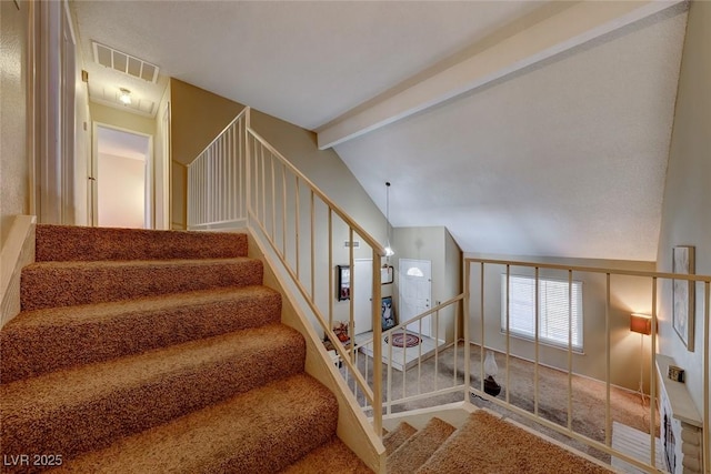 stairs with lofted ceiling with beams and visible vents