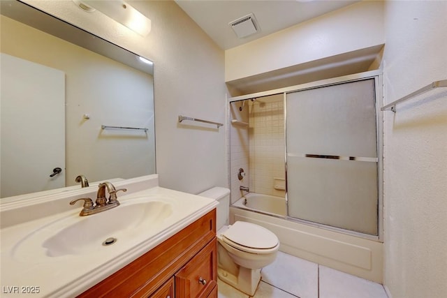 bathroom with vanity, visible vents, enclosed tub / shower combo, tile patterned floors, and toilet
