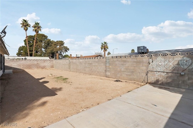 view of yard with a patio and a fenced backyard