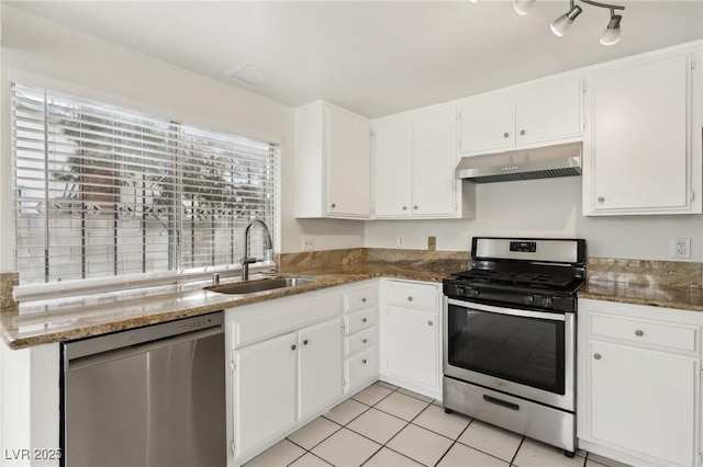 kitchen featuring under cabinet range hood, white cabinetry, stainless steel appliances, and a sink