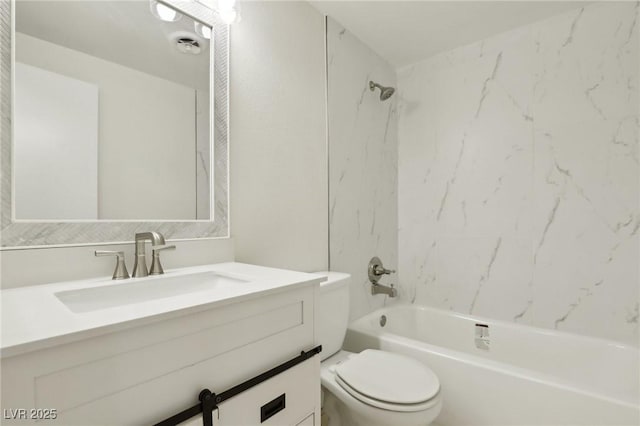 bathroom with tub / shower combination, toilet, and vanity