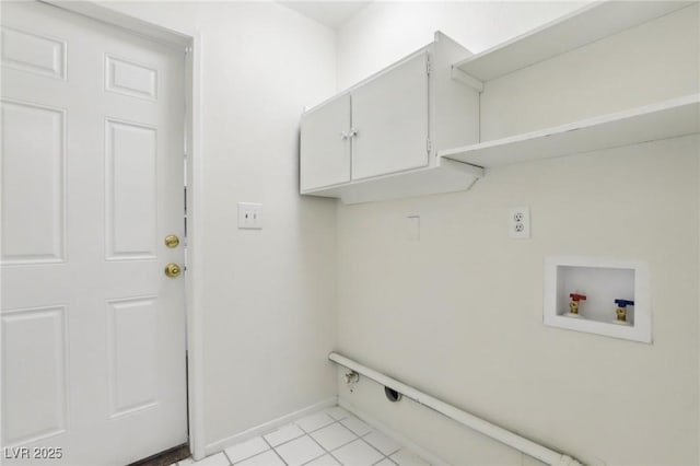 washroom featuring light tile patterned floors, baseboards, cabinet space, and washer hookup