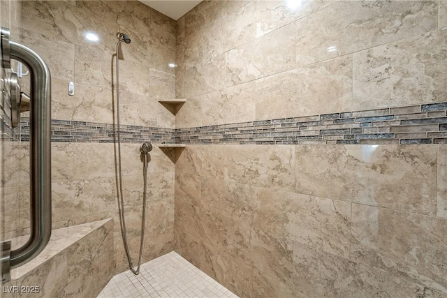 full bath featuring a shower stall