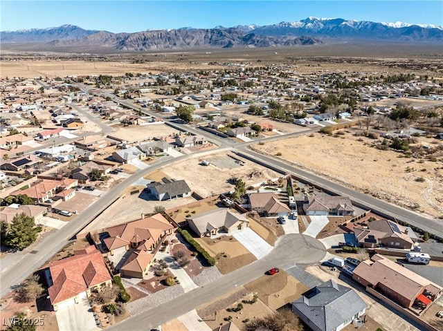 bird's eye view featuring a residential view and a mountain view