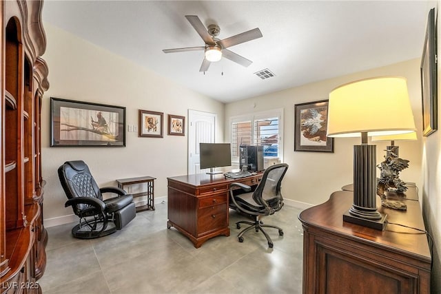 home office featuring baseboards, visible vents, a ceiling fan, and lofted ceiling