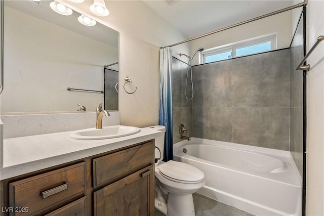 full bathroom featuring shower / bath combo with shower curtain, toilet, and vanity