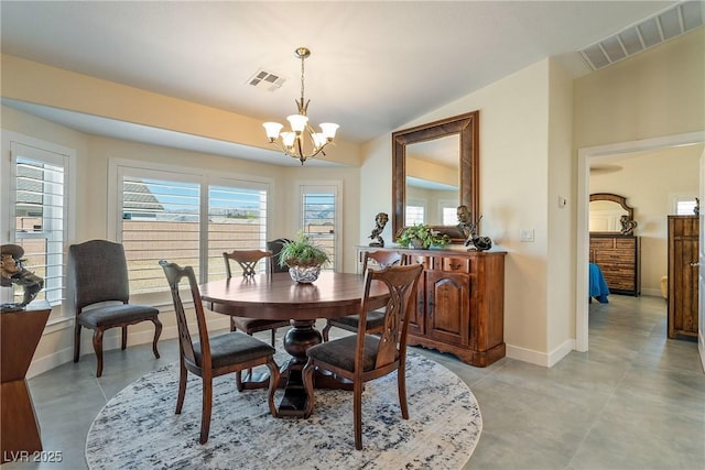 dining area featuring vaulted ceiling, a notable chandelier, baseboards, and visible vents