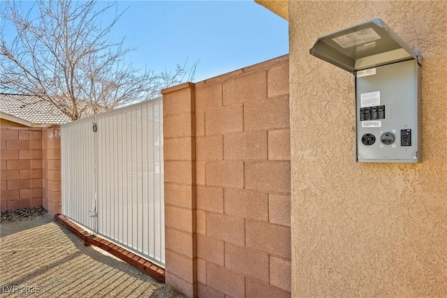 exterior space with fence and stucco siding