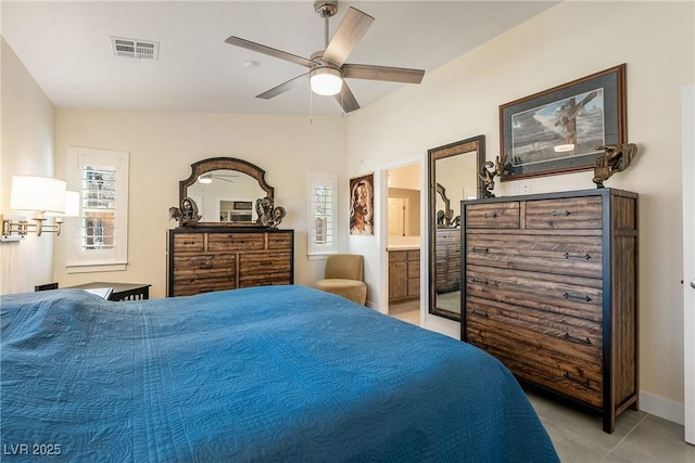 bedroom with light tile patterned floors, visible vents, ensuite bath, and ceiling fan