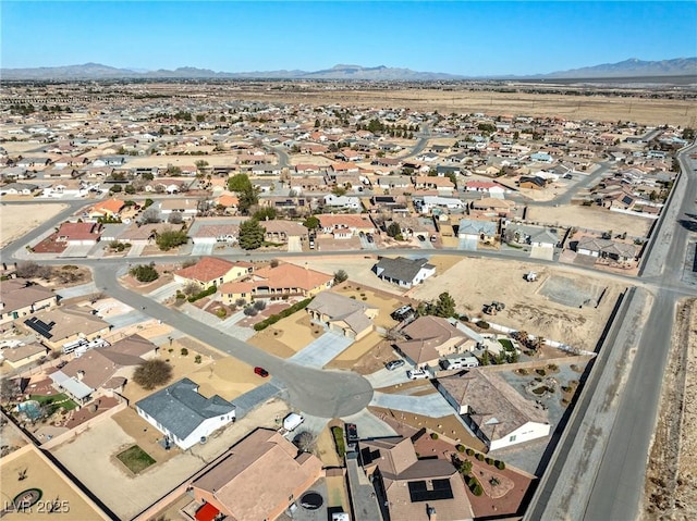 aerial view featuring a mountain view and a residential view